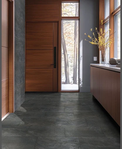 Dark flooring beside a wooden entrance door
